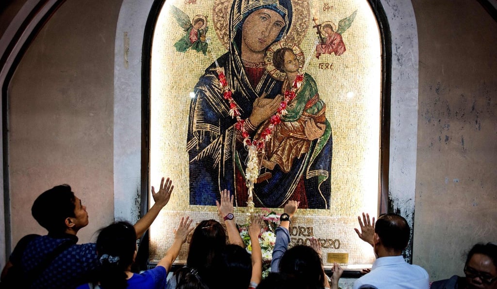 Filipinos pray at the Baclaran Church in Manila. Photo: AFP