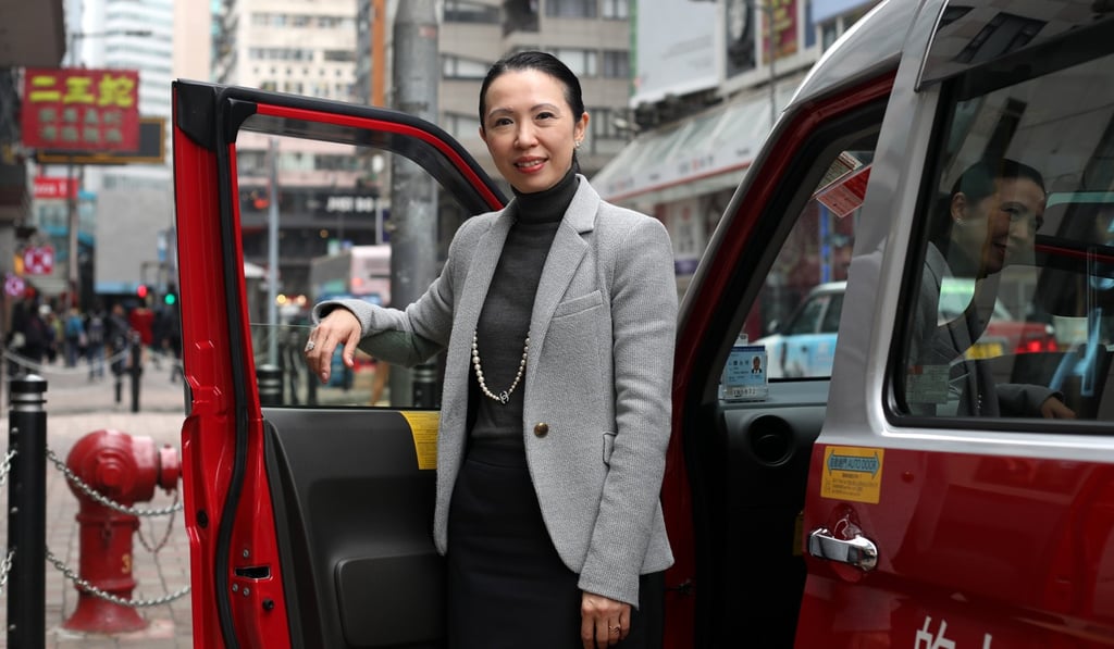 Stevie Wong, Inchcape CEO for China, with a hybrid taxi in Causeway Bay. Photo: Xiaomei Chen