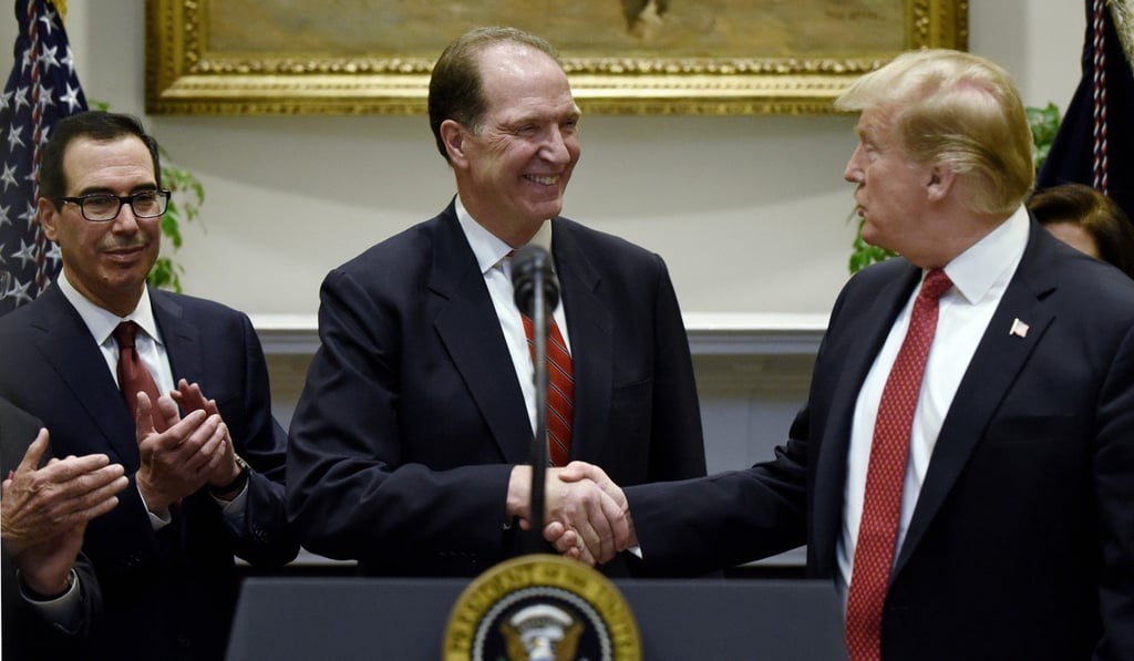 David Malpass shakes hands with US President Donald Trump after his nomination to become World Bank president was announced on Wednesday at the White House. Treasury Secretary Steven Mnuchin is at left. Photo: Abaca Press/TNS