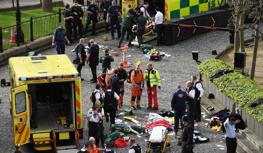 Emergency services on Wednesday, March 22, 2017 at the scene outside the Palace of Westminster, London, after a policeman was stabbed and his apparent attacker shot by officers in a major security incident at the Houses of Parliament. Photo: Stefan Rousseau/PA Wire/Zuma Press/TNS