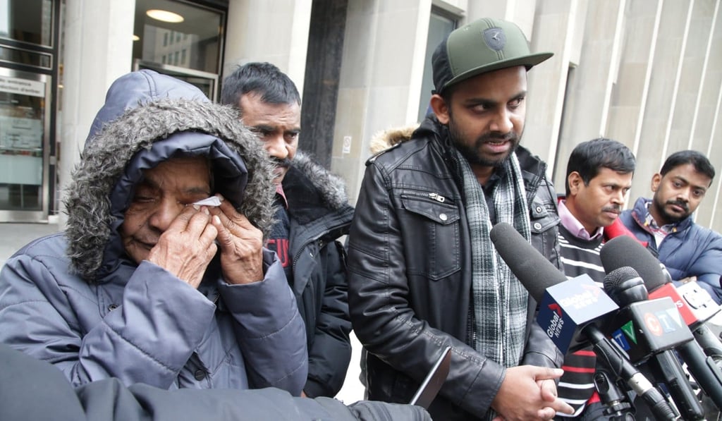 Santhanaladchumy Kanagaratnam, mother of Kirushna Kumar Kanagaratnam, one of the men who were killed, reacts as his friend Piranavan Thangavel speaks to reporters after McArthur was sentenced to life imprisonment in Toronto on Friday. Photo: Reuters