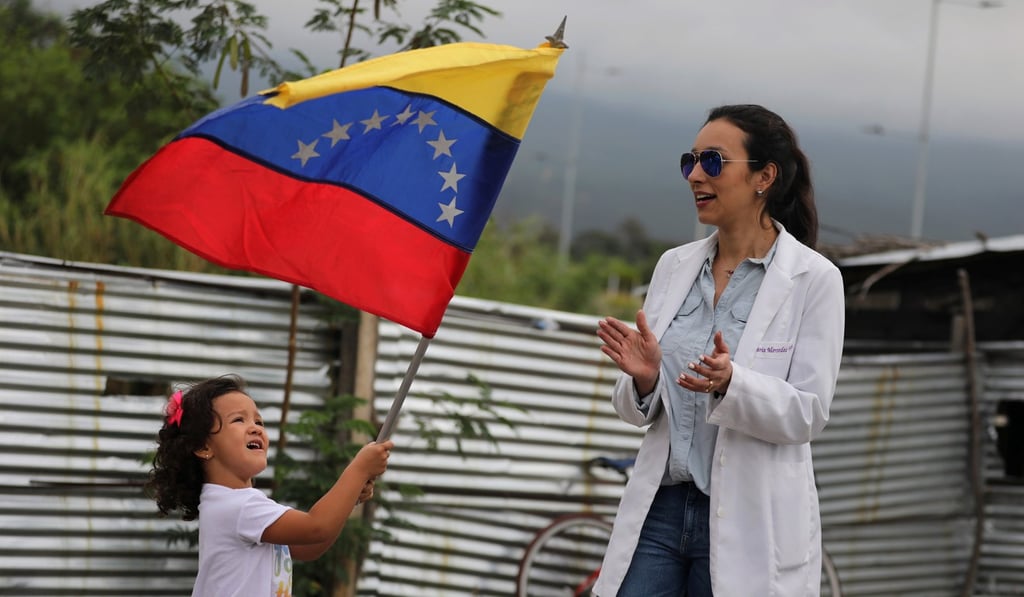Venezuelan doctors attend a gathering at the entrance of a warehouse where humanitarian aid for Venezuela is being stored, near the Tienditas cross-border bridge between Colombia and Venezuela, in Cucuta, Colombia February 10, 2019. Photo: Reuters