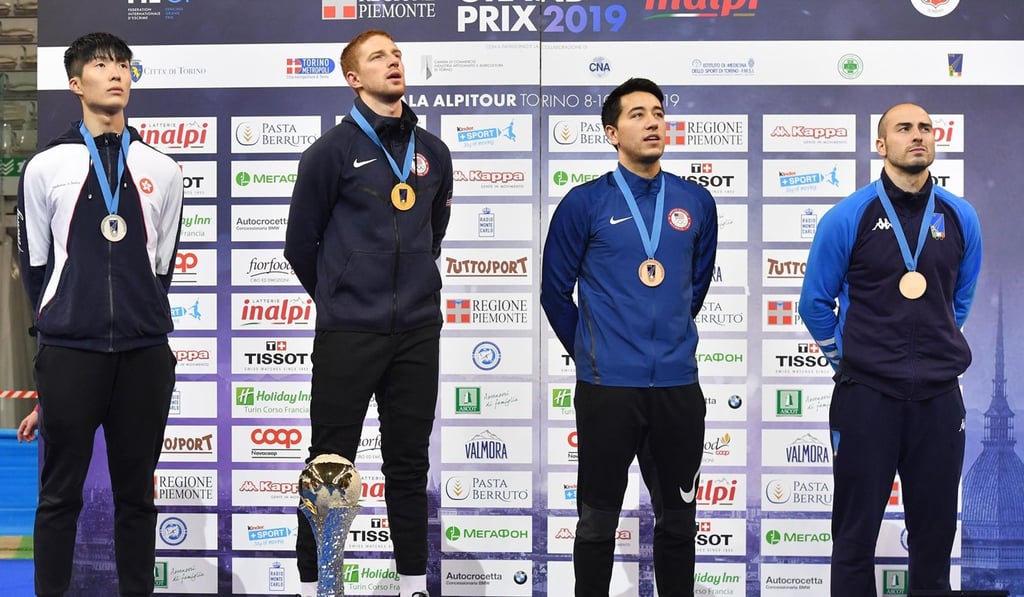Cheung Ka-long (left) captures his first silver medal at a grand prix event.