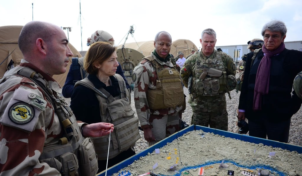 US and French military personnel at a French artillery base near al-Qaim in Iraq's western Anbar province opposite Syria's Deir Ezzor region, a few kilometres away from the last scrap of territory held by IS in eastern Syria. Photo: AFP