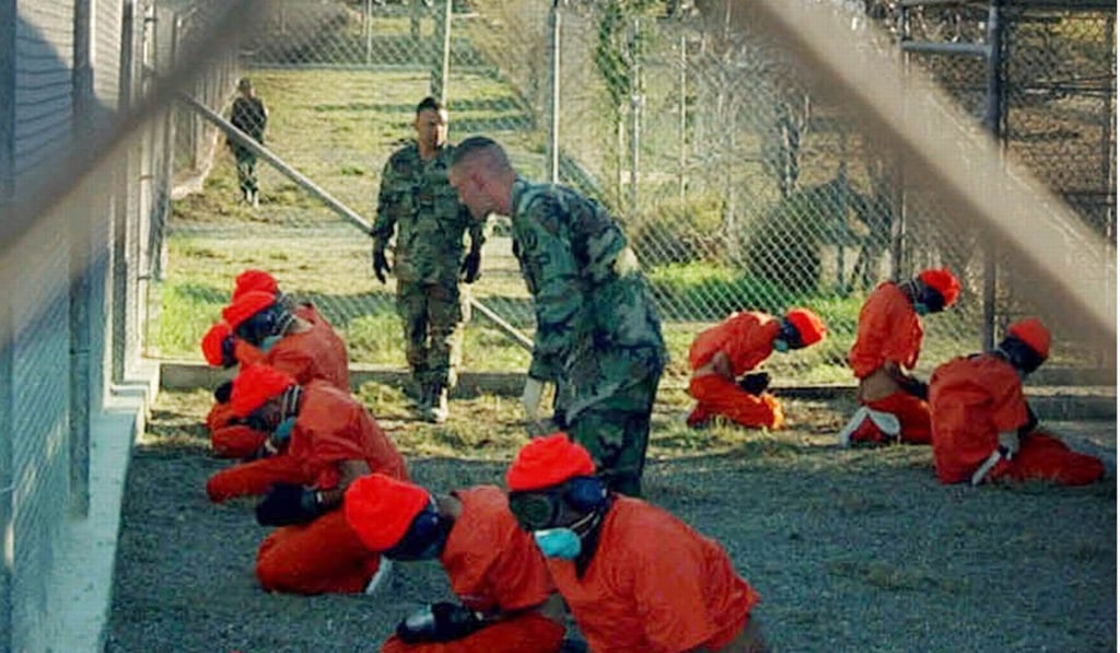 Detainees in orange jumpsuits at Guantanamo Bay, Cuba, in January 2002. Photo: Reuters