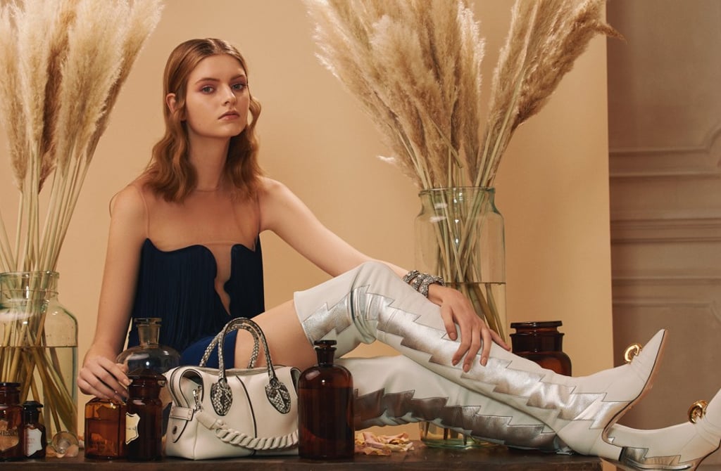 Stella McCartney blue fringed dress, HK$12,470; Gucci white leather boots, HK$31,000; Gucci bracelet with snake motif and crystals, HK$26,400; Tod’s D Styling bag in powder-pink leather and python handles, HK$17,890 Stella McCartney blue fringed dress, HK$12,470; Gucci white leather boots, HK$31,000; Gucci bracelet with snake motif and crystals, HK$26,400; Tod’s D Styling bag in powder-pink leather and python handles, HK$17,890