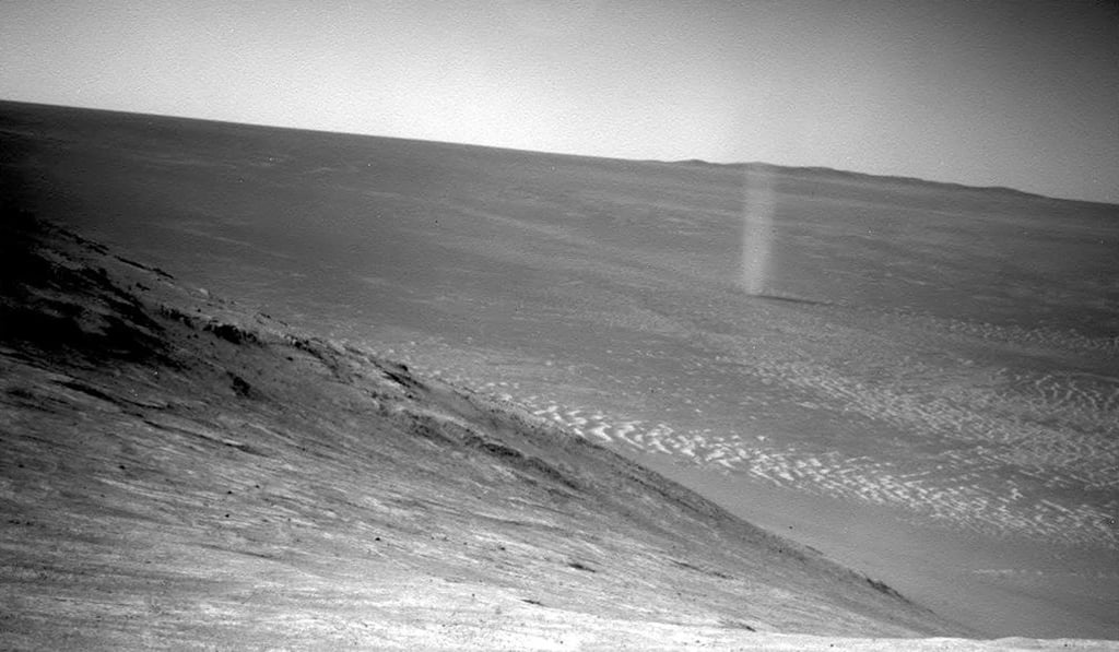 This March 31, 2016 photo shows a dust devil in a valley on Mars, seen by the Opportunity rover perched on a ridge. Photo: AP