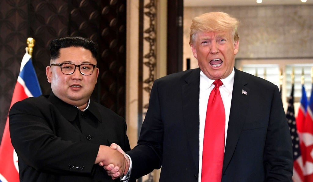 In this file photo taken on June 12, 2018, US President Donald Trump (right) and North Korea's leader Kim Jong-un shake hands following a signing ceremony during their historic summit, at the Capella Hotel on Sentosa island in Singapore. Photo: Agence France-Presse