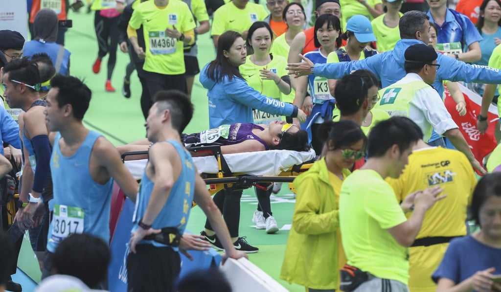 A runner is taken away on a stretcher at the finish in Causeway Bay last year. Photo: Nora Tam