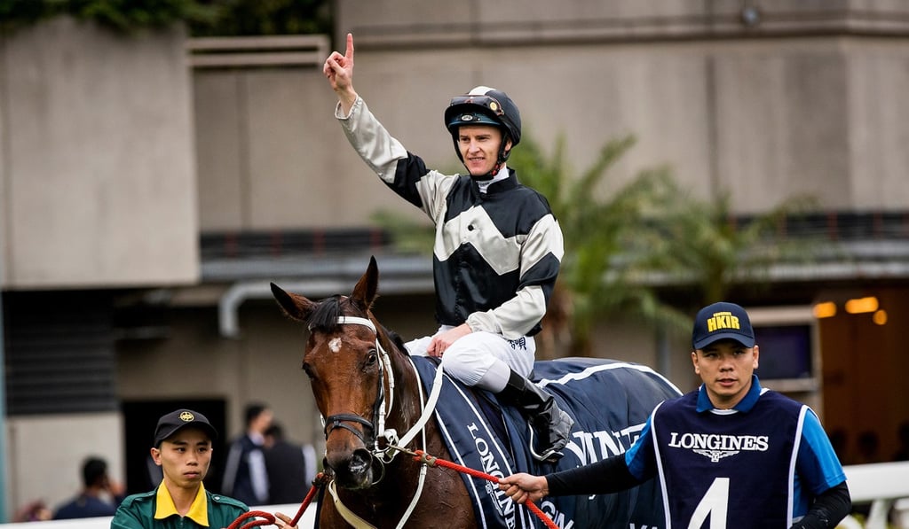Zac Purton, atop Exultant, acknowledges the applause after winning Longines Hong Kong Vase at Sha Tin last December