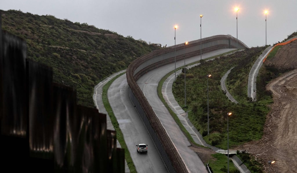 A Border Patrol unit drives near a section of reinforced US-Mexico border fence seen from Tijuana, Baja California state, Mexico, on February 14, 2019. Photo: AFP A Border Patrol unit drives near a section of reinforced US-Mexico border fence seen from Tijuana, Baja California state, Mexico, on February 14, 2019. Photo: AFP