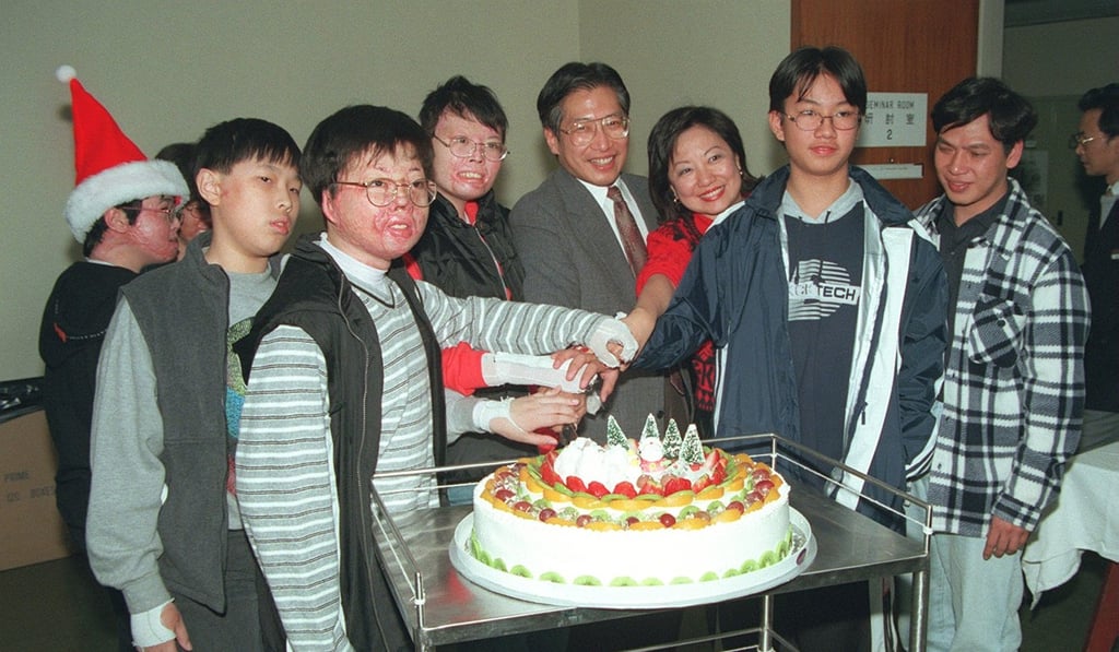 Victims of the fire cut a cake at the at the Prince of Wales Hospital, in December 1996. Picture: SCMP