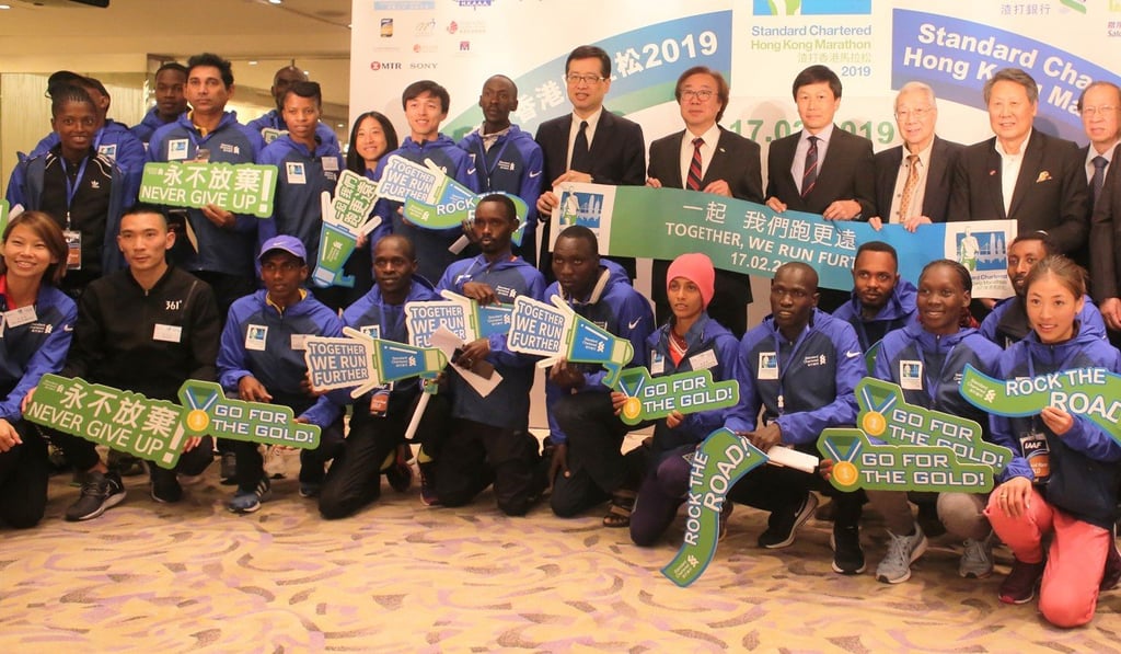 Runners and officials for the Standard Chartered Hong Kong Marathon meet the press. Photo: Chan Kin-wa
