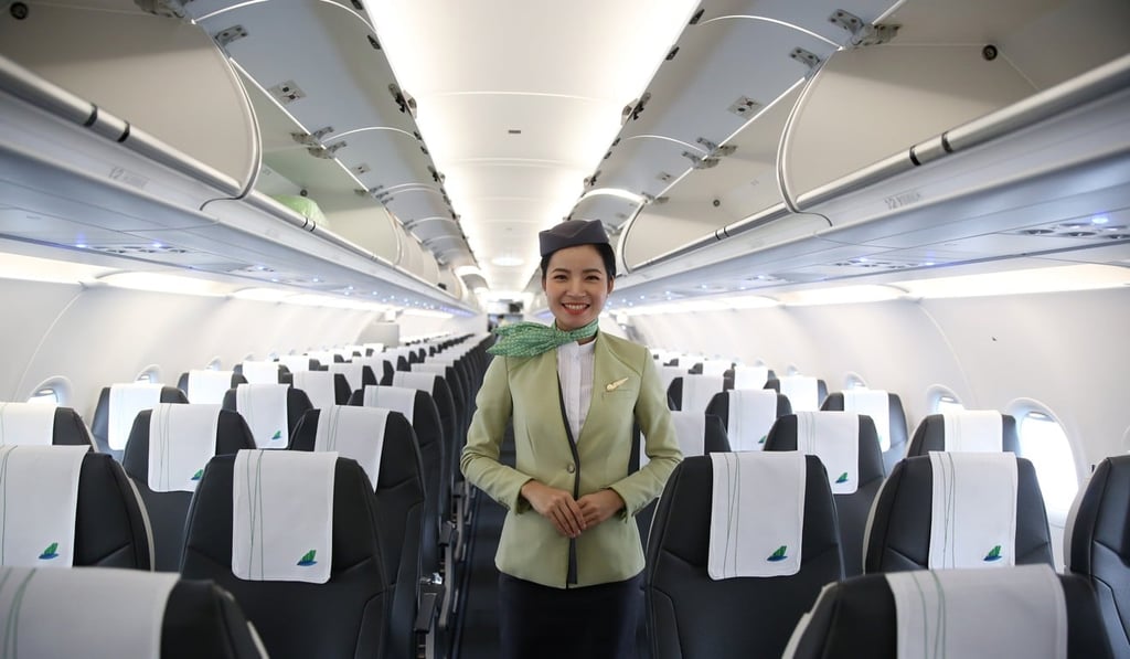 A Bamboo Airways flight attendant on the runway in Hanoi. Photo: Bloomberg