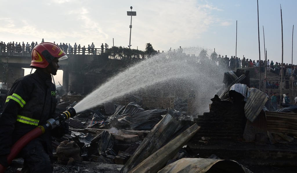 A firefighter at the slum in Chittagong. Photo: Reuters