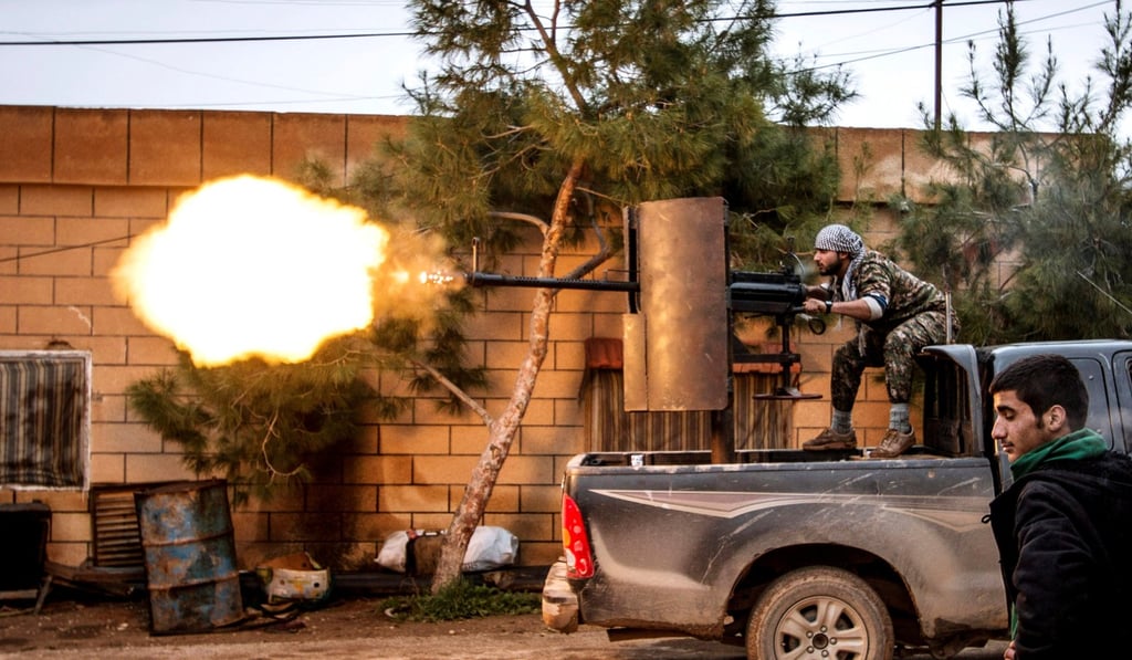 File photo of a Kurdish fighter firing an anti-aircraft weapon in Tel Tawil, Syria. Photo: Reuters