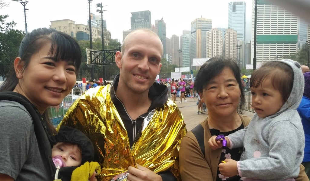 Tilman Altmeppen after finishing the Hong Kong Marathon with his wife Tiff, two children and mother-in-law. Photo: Patrick Blennerhassett