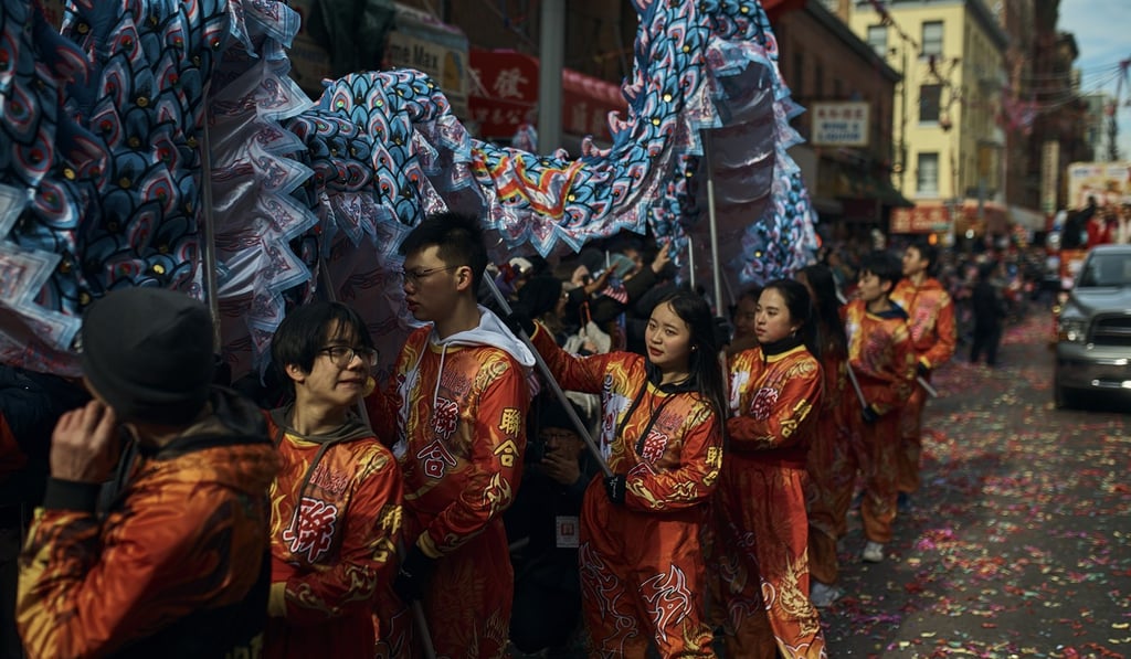 Members of a dragon dance group carrying a dragon pause during the Chinese Lunar New Year parade in Chinatown in New York. Photo: AP Photo