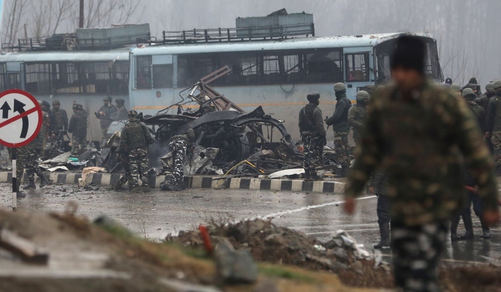 Indian soldiers inspect the site of the blast in Lethpora, in south Kashmir’s Pulwama district on February 14, 2019. Photo: EPA