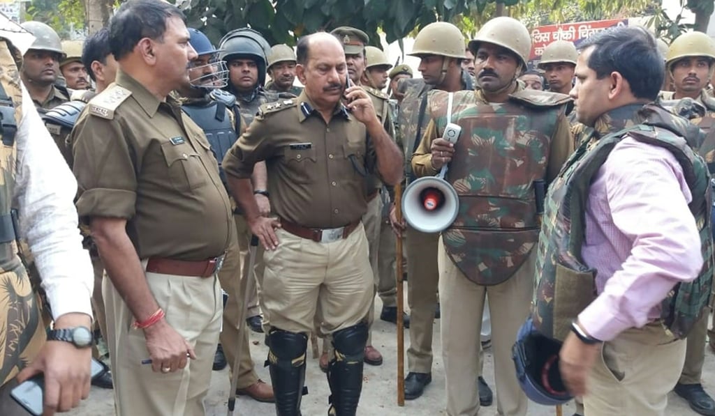 Policemen gather following reports of mob violence at Chingravati village in Bulandhahr. Photo: AFP Policemen gather following reports of mob violence at Chingravati village in Bulandhahr. Photo: AFP