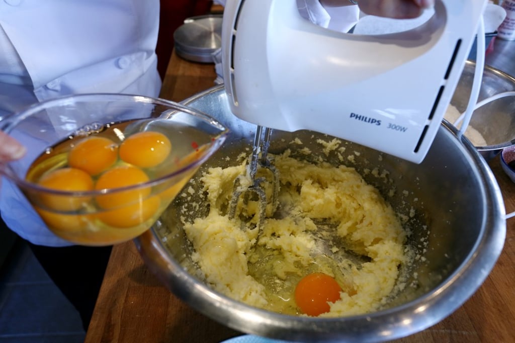 Beat the butter, sugar, salt, baking powder and baking soda, then mix in one egg.