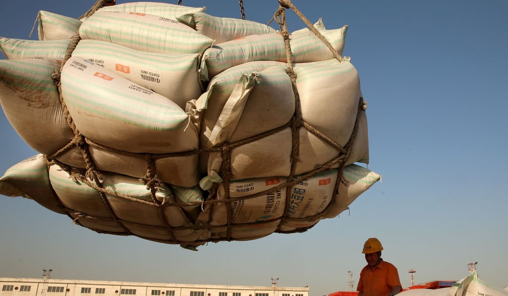 Workers at a port in Nantong, Jiangsu province, bring imported soy ashore. Photo: Reuters