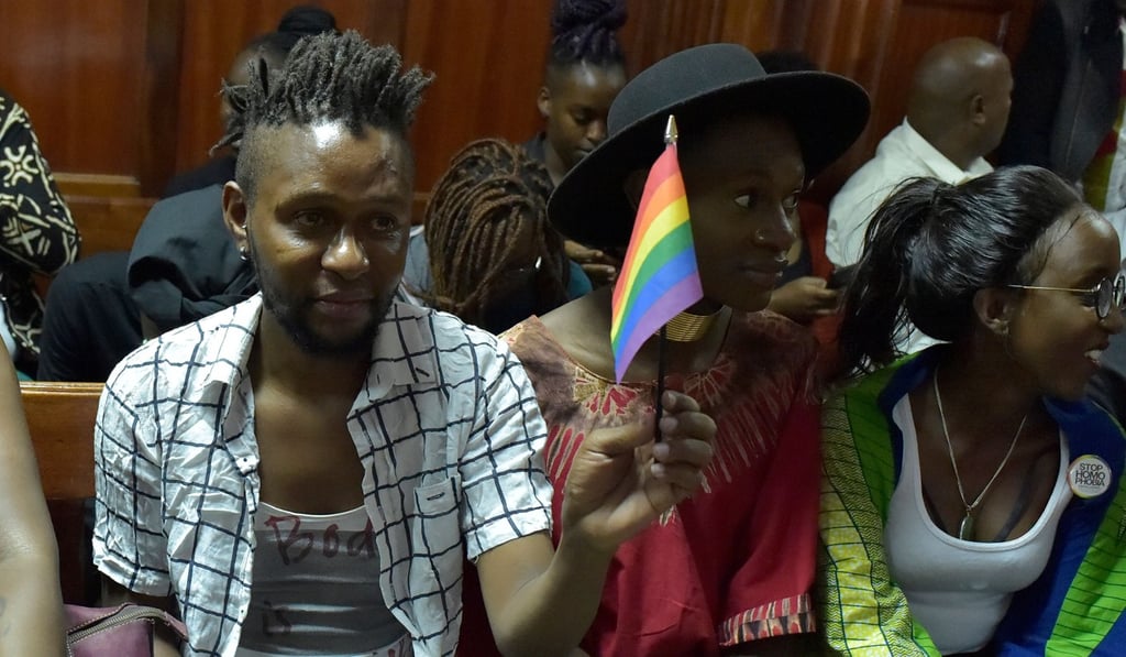 An LGBT activists holds a rainbow flag as he attends a court hearing in the Milimani High Court in Nairobi on February 20, 2019. Photo: AFP