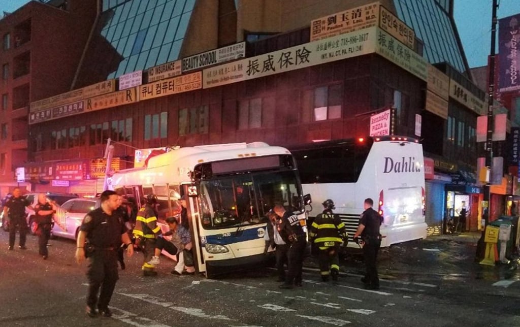 The September 18, 2017 photo provided by the NYPD's 109th Precinct shows the aftermath of the deadly collision involving two buses on Main Street in the Queens borough of New York. Photo: AP