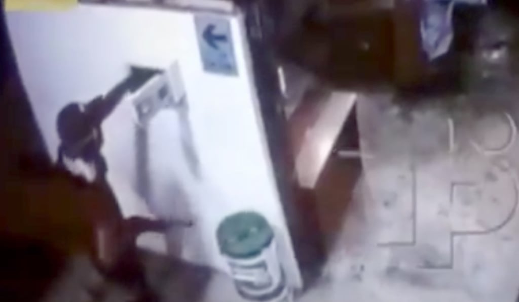 A CCTV screen grab shows a robber during Thursday’s attack. Photo: Handout A CCTV screen grab shows a robber during Thursday’s attack. Photo: Handout