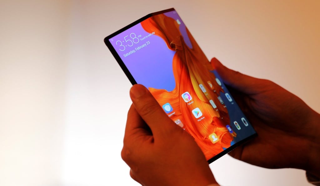 A Huawei staff member shows the new Huawei Mate X device during a pre-briefing display ahead of the Mobile World Congress in Barcelona, Spain. Photo: Reuters