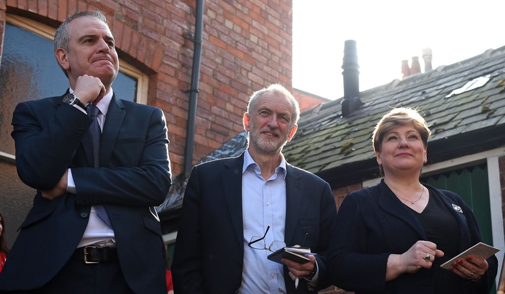 Opposition Labour party leader Jeremy Corbyn (centre) waits with shadow foreign secretary Emily Thornberry (right) and prospective parliamentary candidate Greg Marshall (left) ahead of Corbyn's address at a rally on Saturday, in Broxtowe, central England. Photo: AFP Opposition Labour party leader Jeremy Corbyn (centre) waits with shadow foreign secretary Emily Thornberry (right) and prospective parliamentary candidate Greg Marshall (left) ahead of Corbyn's address at a rally on Saturday, in Broxtowe, central England. Photo: AFP