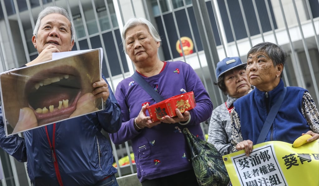 Grassroot and elderly welfare concern groups appeal to Financial Secretary Paul Chan Mo-po for budget relief sweeteners, outside the Central Government Offices in Tamar this month. Photo: K.Y. Cheng