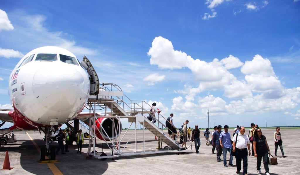 Passengers disembark an Airasia flight in Malaysia. Photo: Alamy