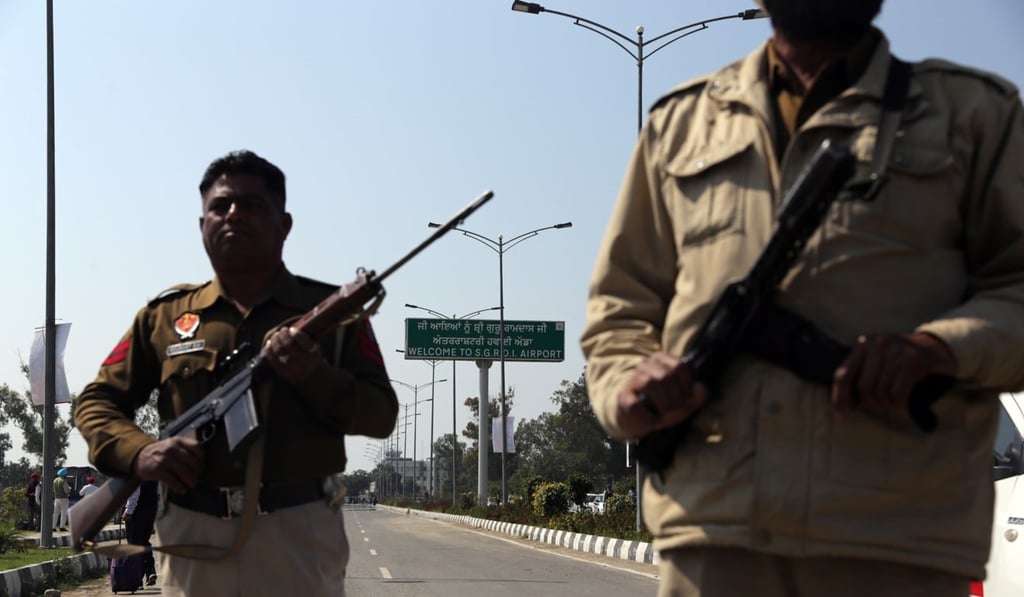 Indian police officers stand guard at barricades outside Sri Guru Ramdas Ji International Airport in wake of border tension between India and Pakistan. Photo: EPA Indian police officers stand guard at barricades outside Sri Guru Ramdas Ji International Airport in wake of border tension between India and Pakistan. Photo: EPA