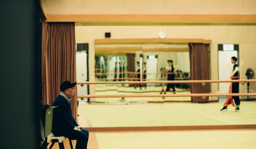 Martial arts teacher Zheng Fukang watches as Sam Chan practises in front of him. Photo: Abdela Igmirien Martial arts teacher Zheng Fukang watches as Sam Chan practises in front of him. Photo: Abdela Igmirien