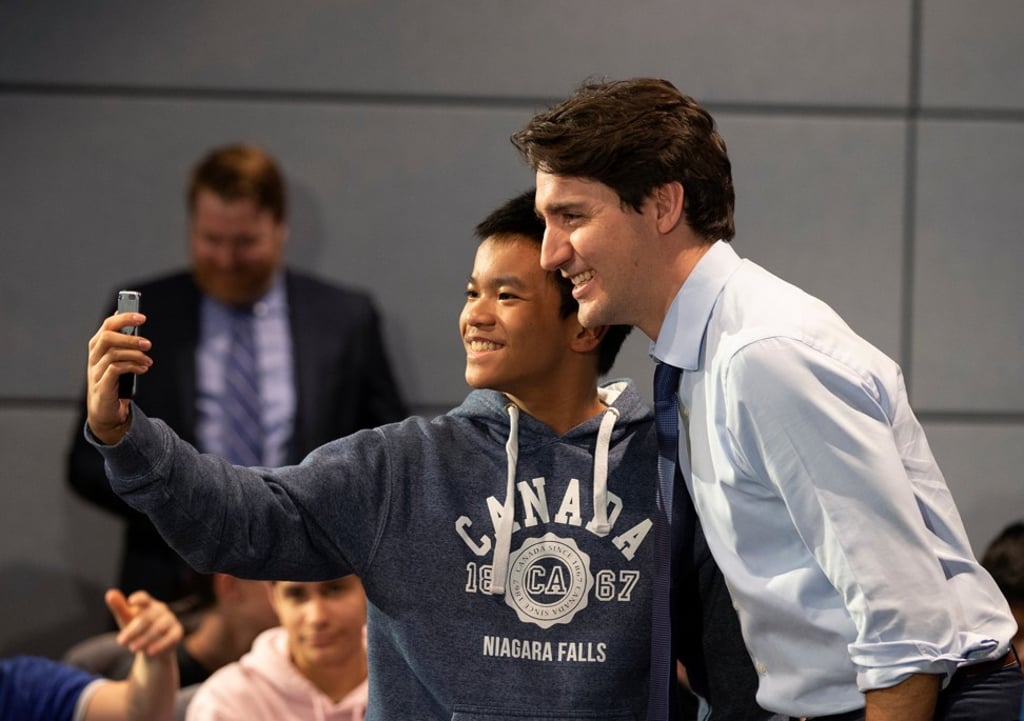 Canadian Prime Minister Justin Trudeau has a selfie taken with a student at the Canadian Space Agency in Longueuil, Quebec, on Thursday. Photo: Reuters