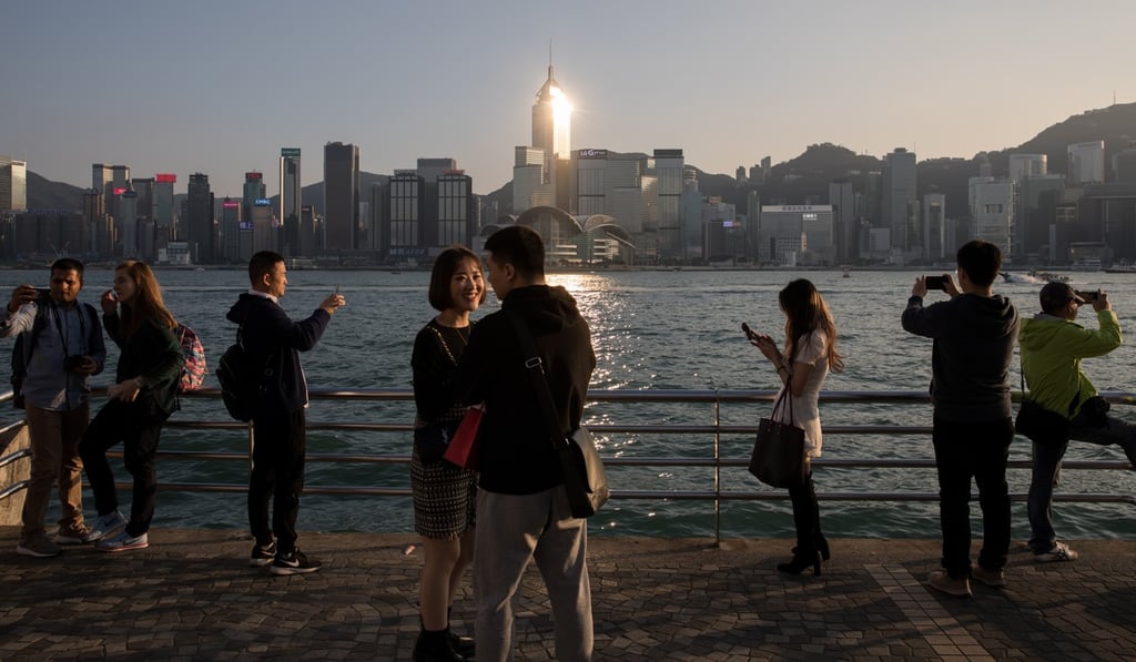 The first of the eight measures would offer a more relaxed tax regime to Hong Kong professionals travelling across the border to work in the bay area cities. Photo: EPA