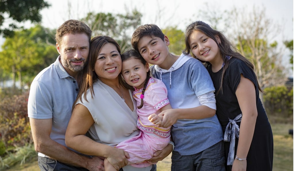 Thatcher and Wong with their children Mia (centre), Ashton and Kira (far right).