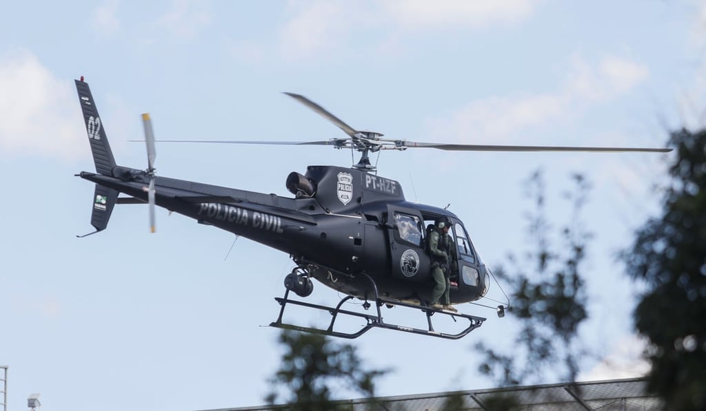 A police helicopter carrying Brazilian former president (2003-2011) Luiz Inacio Lula da Silva, arrives at the Federal Police headquarters in Curitiba, Parana state, Brazil where he is serving a 12-year prison sentence, after a federal court authorised his release for a few hours to attend his grandson’s funeral in Sao Paulo, on March 2, 2019. Photo: AFP