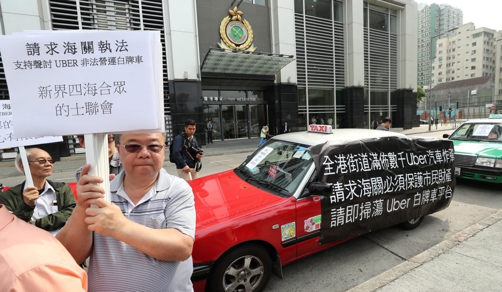 Taxi groups in an anti-Uber protest outside Customs headquarters in North Point. Photo: Winson Wong