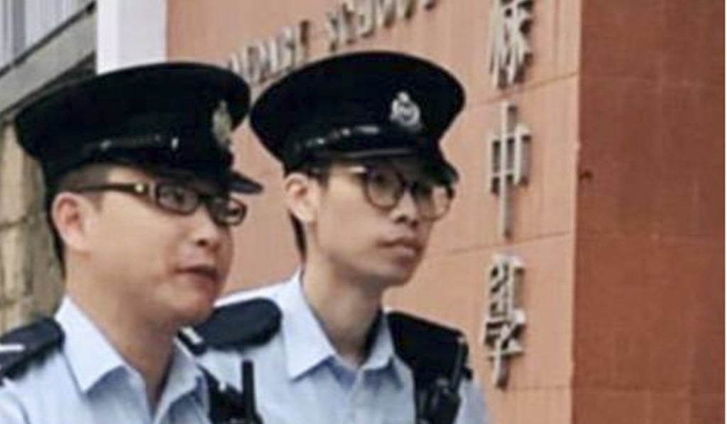 Two police officers arrive at St Paul's Secondary School after a call from a teacher. Photo: Handout