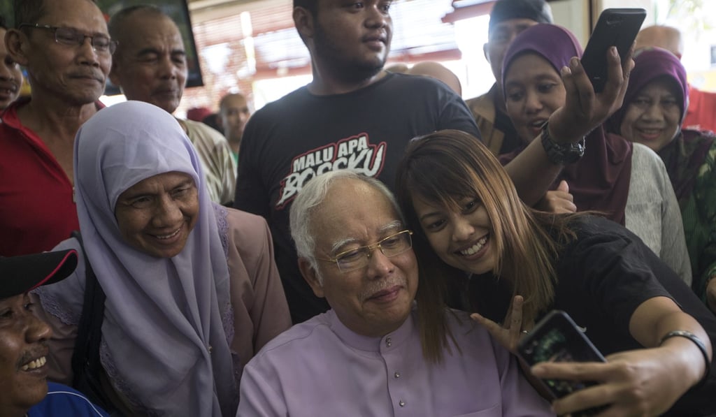 Former Malaysian prime minister Najib Razak has been trying to shed the image of a wealthy, elite politician and elicit public sympathy ahead of corruption trials due this year. Photo: EPA