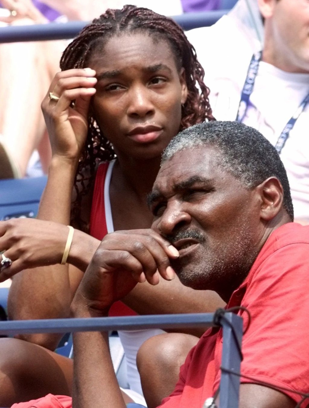In this 2000 file photo, Venus Williams and father Richard Williams watch Serena Williams play at the US Open in New York. Photo: AP