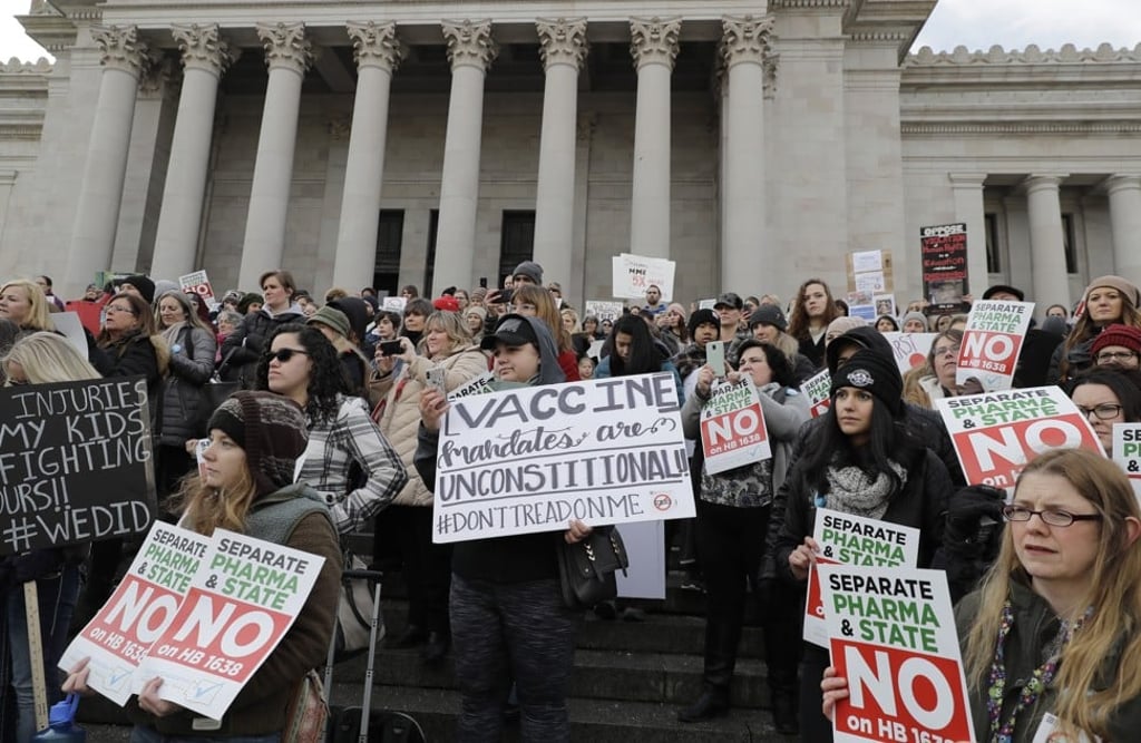 Anti-vaccination protesters rally in Olympia, Washington, on February 8 to oppose a bill that would prevent parents claiming a philosophical exemption against their school-age children receiving the measles, mumps and rubella (MMR) vaccine. Photo: AP Anti-vaccination protesters rally in Olympia, Washington, on February 8 to oppose a bill that would prevent parents claiming a philosophical exemption against their school-age children receiving the measles, mumps and rubella (MMR) vaccine. Photo: AP