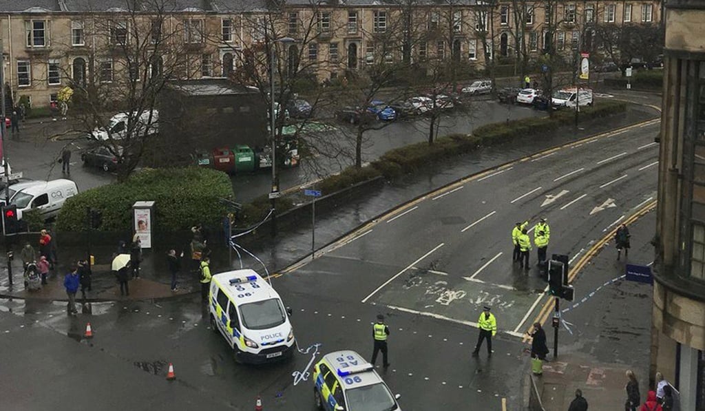 The scene as police secure the area outside the University of Glasgow, Scotland, after a suspicious package was found. Photo: AP Photo The scene as police secure the area outside the University of Glasgow, Scotland, after a suspicious package was found. Photo: AP Photo