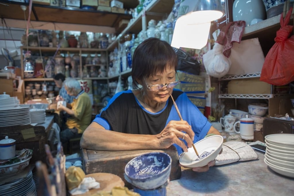 Porcelain is hand-painted at Yuet Tung China Works, in Kowloon Bay. Photo: Antony Dickson