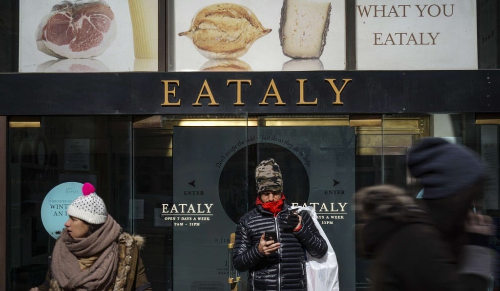 Customers exit Eataly, a New York City food emporium that Batali sold his stake in. Photo: AFP Customers exit Eataly, a New York City food emporium that Batali sold his stake in. Photo: AFP