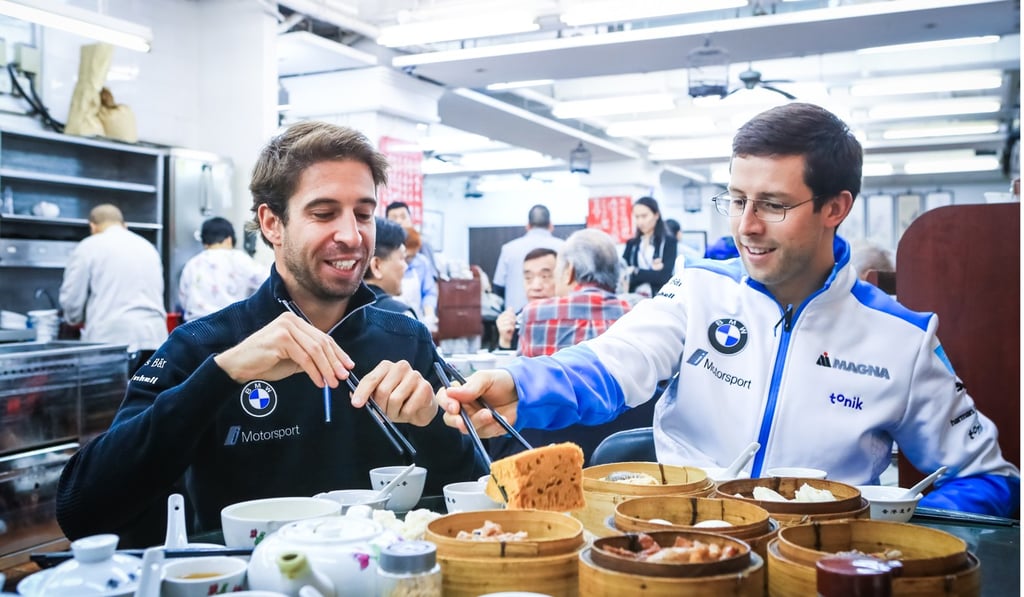 Antonio Felix da Costa and Alexander Sims try some dim sum.