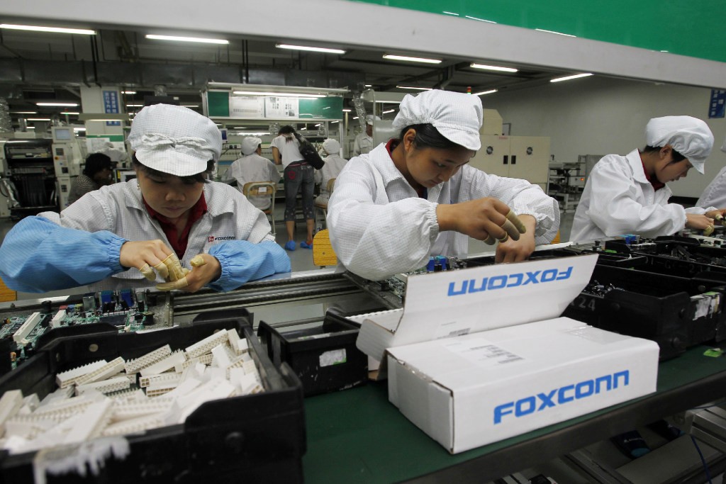 A production line at the Foxconn complex in Shenzhen in 2010 (Picture: AP Photo) A production line at the Foxconn complex in Shenzhen in 2010 (Picture: AP Photo)