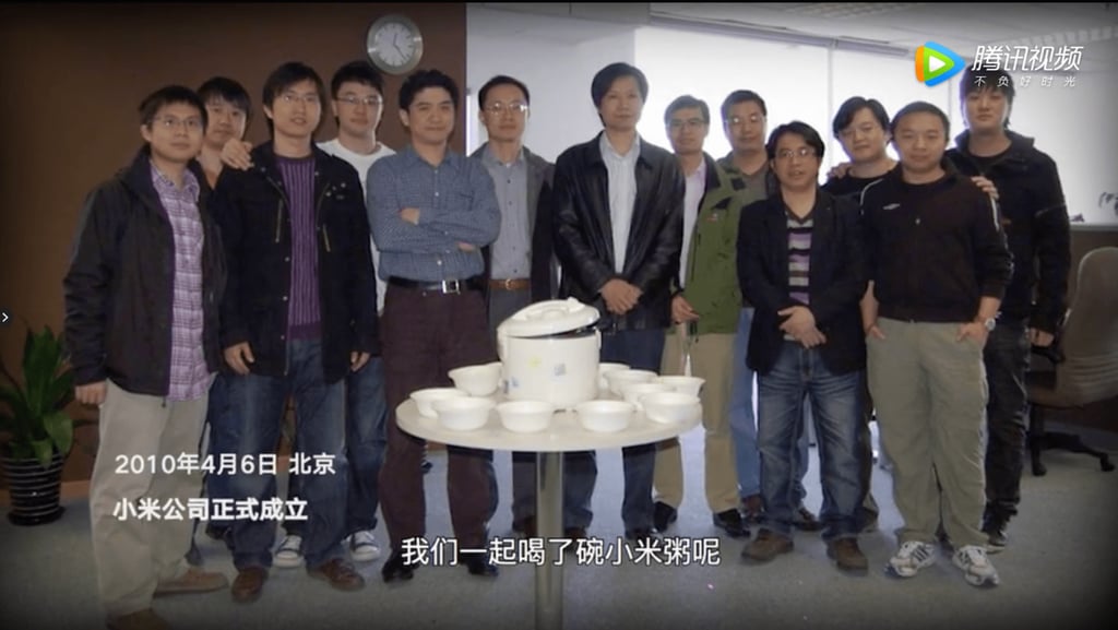 Lei Jun (center, in black jacket) with his founding team on their first day at Xiaomi. (Picture: Xiaomi/Tencent Video)